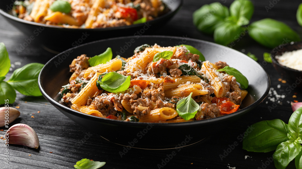 Creamy Tuscan pasta with minced beef, sun dried tomatoes, spinach and parmesan cheese Creamy Tuscan pasta with minced beef, sun dried tomatoes, spinach and parmesan cheese