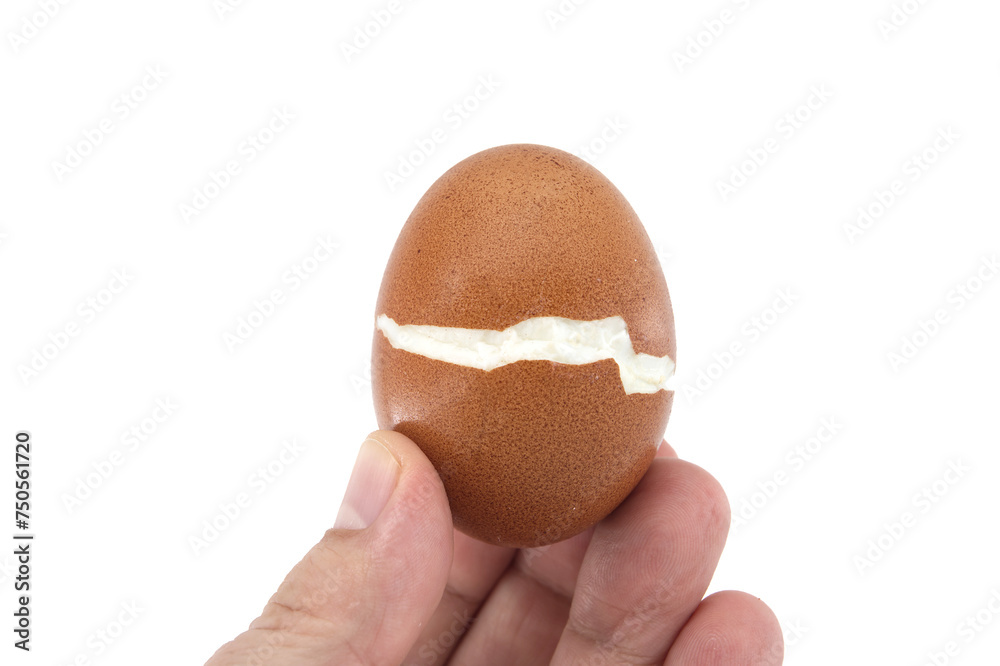 Egg cracked during boiling isolated on white Egg cracked during boiling isolated on white
