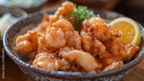 Close-up of deep-fried fish bites in a ceramic bowl.