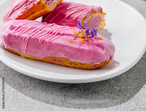 Eclairs with pink glaze close up