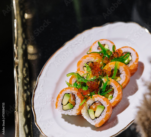 salmon sushi with seaweed on plate