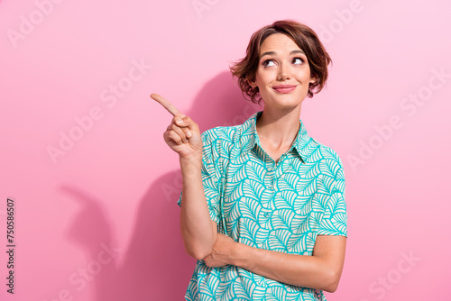 Portrait of stunning positive lady look direct finger empty space proposition isolated on pink color background © deagreez