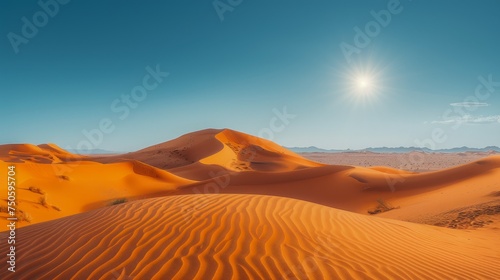 Majestic Sun over Tranquil Sahara Desert Dunes at Sunrise with Clear Blue Sky