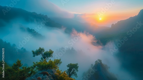 Majestic Mountain Sunrise with Soft Mist Over Forested Peaks Landscape Photograph