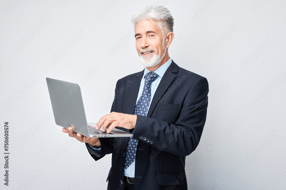 Senior businessman using laptop on white background. Senior businessman using laptop on white background.