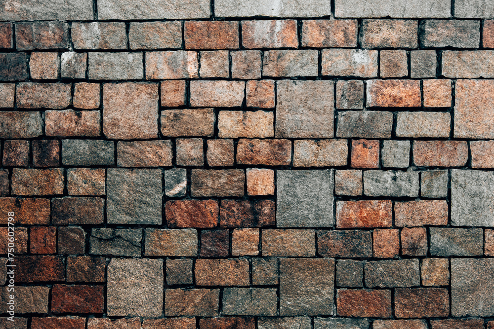 Fototapeta premium Decorative uneven cracked real stone wall surface.