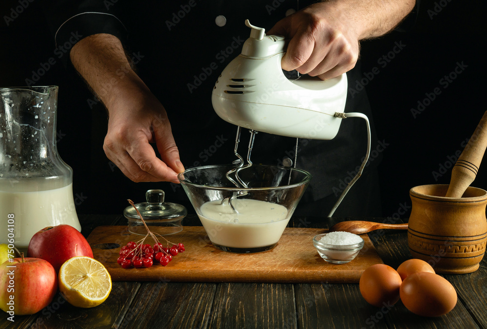 A Professional Chef Prepares An Egg Omelet With Milk Using A Hand Held Electric Mixer Low Key 2347