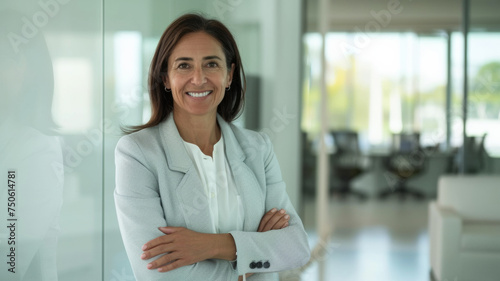 Free Download Mature professional woman smiling confidently in a clean office space. - GFXLoad