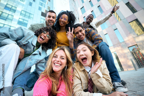 A group of happy people is sharing a fun moment. Young friends take a selfie picture during a leisure event. The team is traveling together. Smiling community portrait looking at camera photo