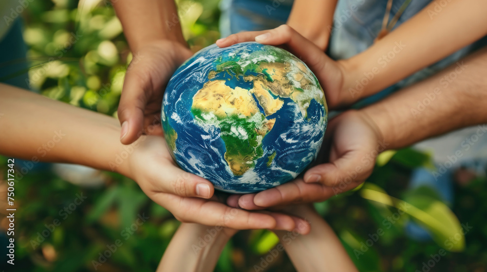 A group of people holding a globe together in a show of unity and care, suitable for illustrating concepts of global cooperation or Earth Day celebrations A group of people holding a globe together in a show of unity and care, suitable for illustrating concepts of global cooperation or Earth Day celebrations