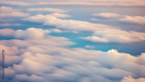 A bird's-eye spectacle: endless azure horizon, where clouds weave dreams in daylight's embrace. Global Warming concept. Video clip. Timelapse. Loop of sky background. 4K UHD.
