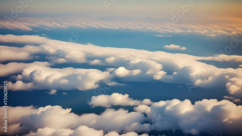 Ethereal dawn breaks, unveiling a sea of clouds. A tranquil spectacle beneath the endless blue expanse.
