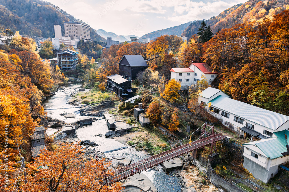 Sapporo, Hokkaido, Japan - November 2023 : Autumn scenery of Jozankei Onsen Resort, a famous hot spring destination with the hotels and traditional Ryokan surrounded by fall colors.