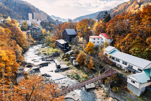 Sapporo, Hokkaido, Japan - November 2023 : Autumn scenery of Jozankei Onsen Resort, a famous hot spring destination with the hotels and traditional Ryokan surrounded by fall colors. photo