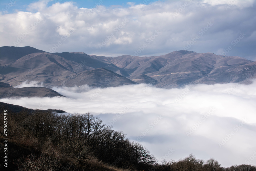 Clouds among the mountains. The clouds covered everything