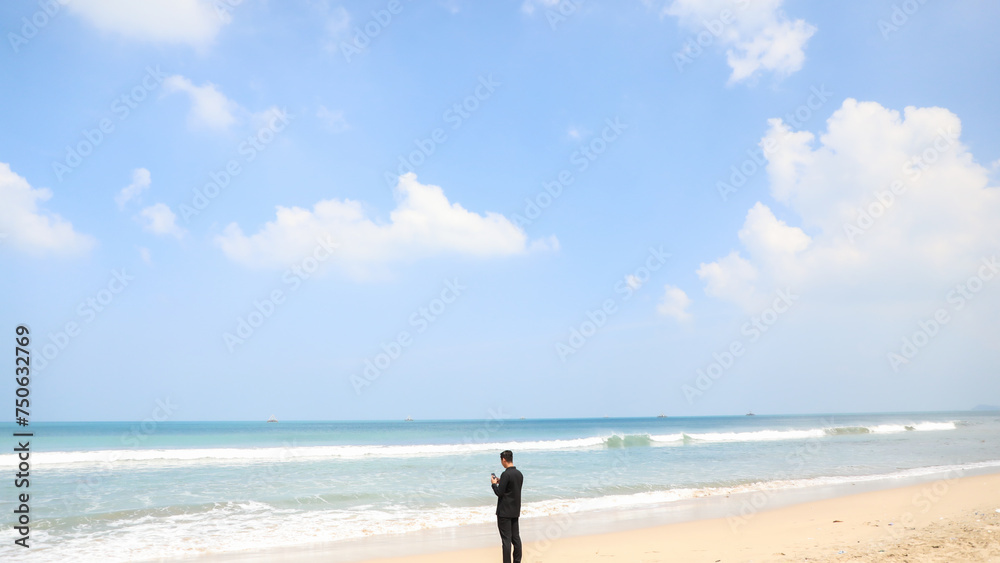 someone standing on the beach alone anxiously