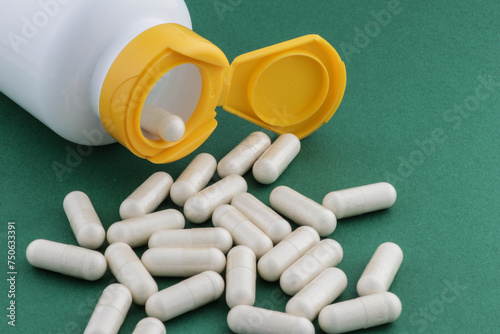 A stack of herbal capsule, dietary supplement, vitamin tablet, herbal medicine