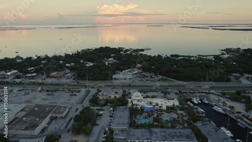 Aerial view over Key Largo towards beautiful sunrise over calm glass like water