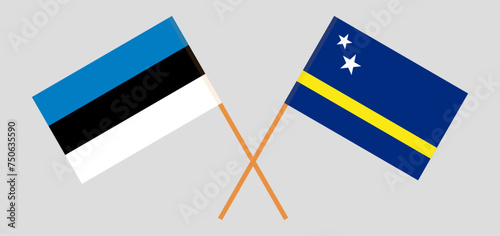 Crossed flags of Estonia and Country of Curacao. Official colors. Correct proportion