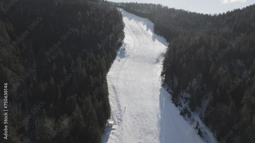 Aerial view of the ski slope and then further to the nearby surroundings, Kope, Slovenija Aerial view of the ski slope and then further to the nearby surroundings, Kope, Slovenija