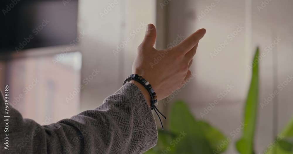 CU on hand - man controls his spatial computer headset with a pinch gesture CU on hand - man controls his spatial computer headset with a pinch gesture