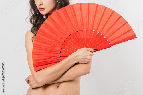 Dancer female with fan in lingerie, nude