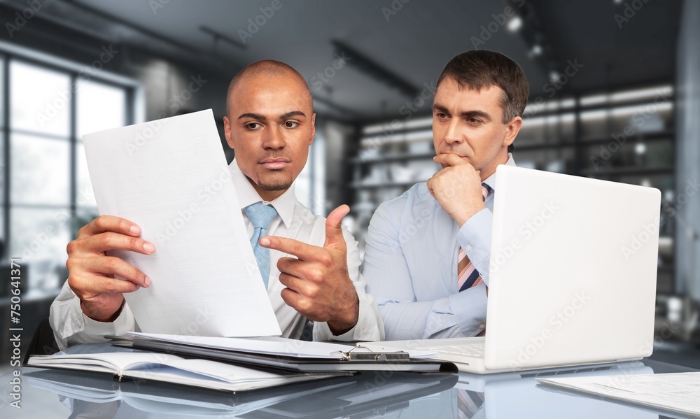 manager teaching young worker discussing strategy manager teaching young worker discussing strategy