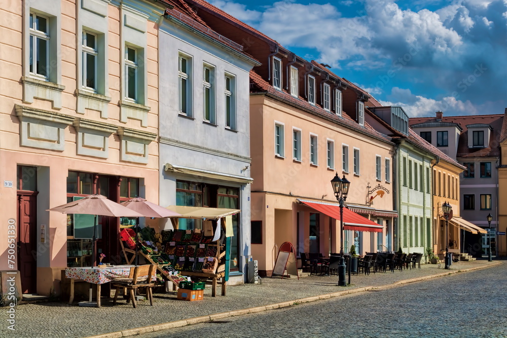 beeskow, deutschland - sanierte häuserzeile am marktplatz