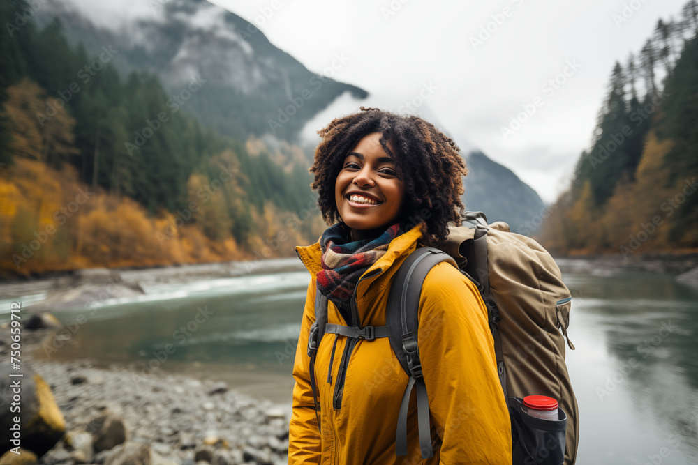  African-American woman hiker with backpack in nature, smiling. Ideal for outdoor adventure, travel, and wellness promotions. Perfect for banners, social media, and advertising campaigns.
