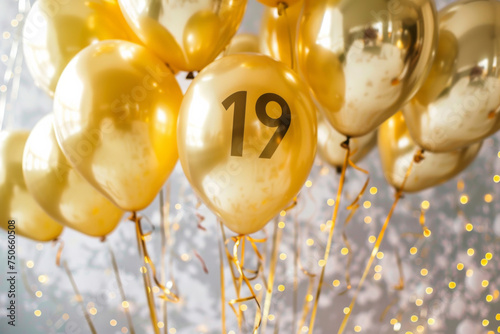 text "19" with golden balloons. party favors, party atmosphere, copy space 
