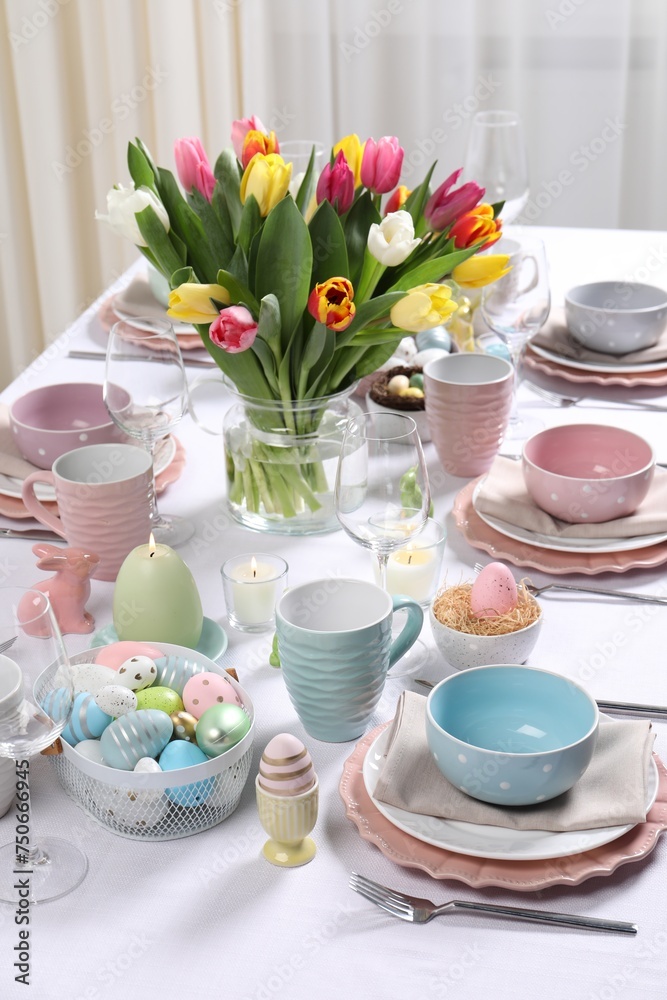 Festive table setting with beautiful flowers. Easter celebration