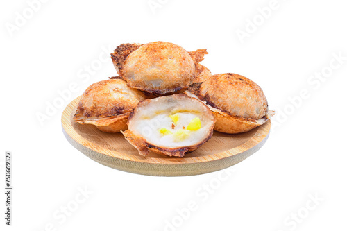  Thai Coconut Puddings with corn kernels toppings (Kanom krok) in wood plate on white background close up,isolated