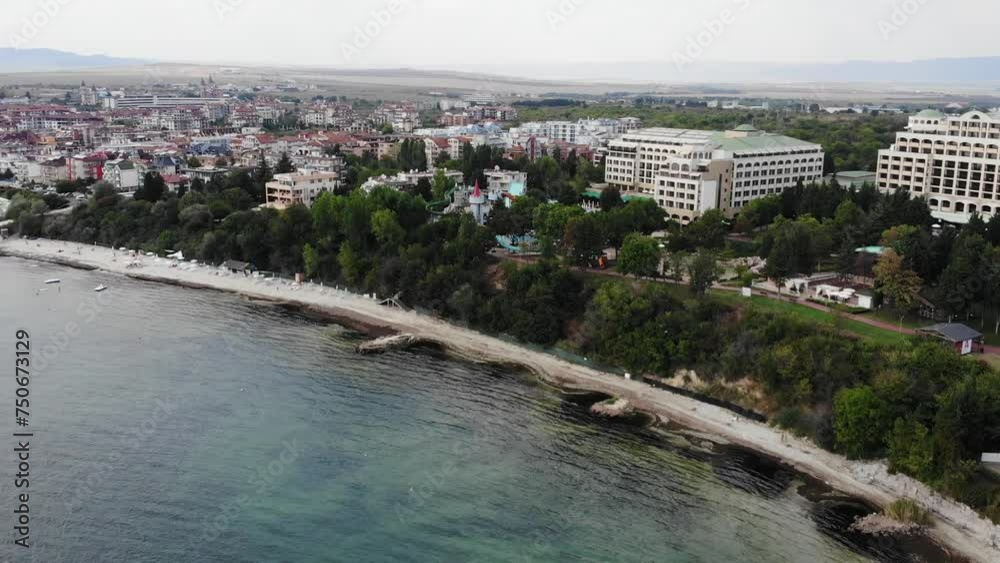 Aerial view of hotels and beaches of Nessebar, houses, and sunbeds. Drone view from above. Summer holidays destination. Aerial view of hotels and beaches of Nessebar, houses, and sunbeds. Drone view from above. Summer holidays destination.
