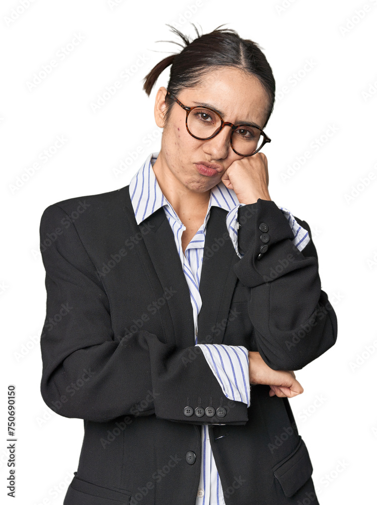 Confident young Caucasian businesswoman on studio background who feels sad and pensive, looking at copy space. Confident young Caucasian businesswoman on studio background who feels sad and pensive, looking at copy space.