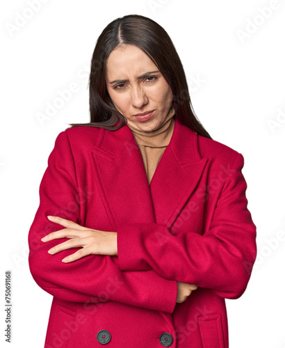 Photos Modern young Caucasian woman portrait on studio background unhappy looking in camera with sarcastic expression