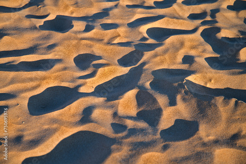 close up of beach sand dunes casting shadows