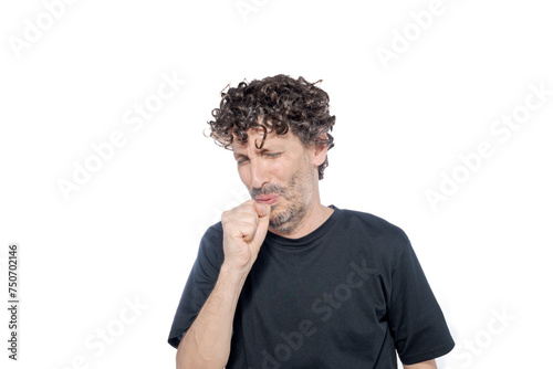 Middle-aged adult male covering his mouth with his fist while coughing, on white background.