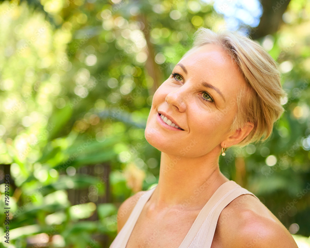 Head And Shoulders Portrait Of Smiling Confident Mature Woman With Short Hair Standing Outdoors Head And Shoulders Portrait Of Smiling Confident Mature Woman With Short Hair Standing Outdoors