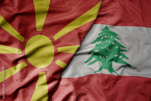 big waving national colorful flag of lebanon and national flag of macedonia . photo