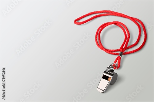 One metal steel whistle with colored cord