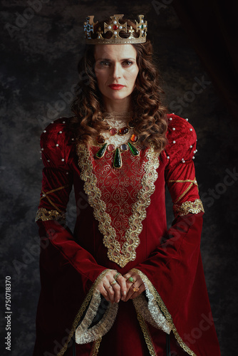 medieval queen in red dress with crown