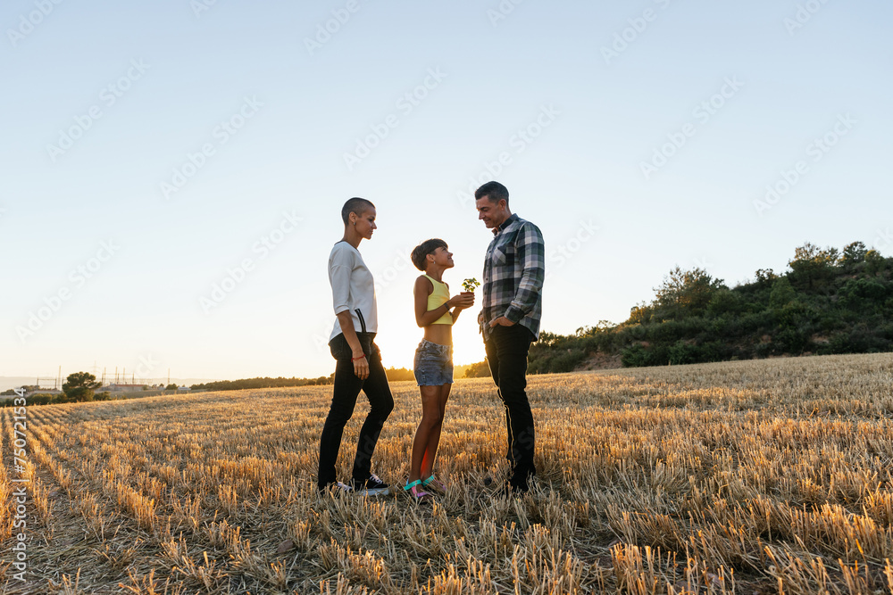 Family enjoys a beautiful sunny day on the outskirts of the city. Family enjoys a beautiful sunny day on the outskirts of the city.