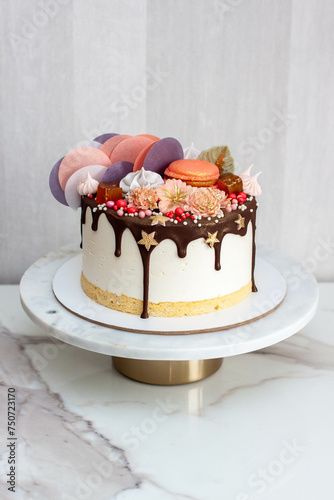 Souffle cake with sponge cake, melted chocolate and bright decorations