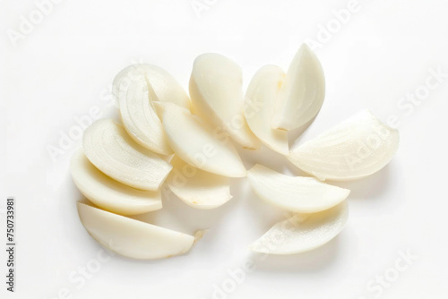 Garlic slices on isolated white background