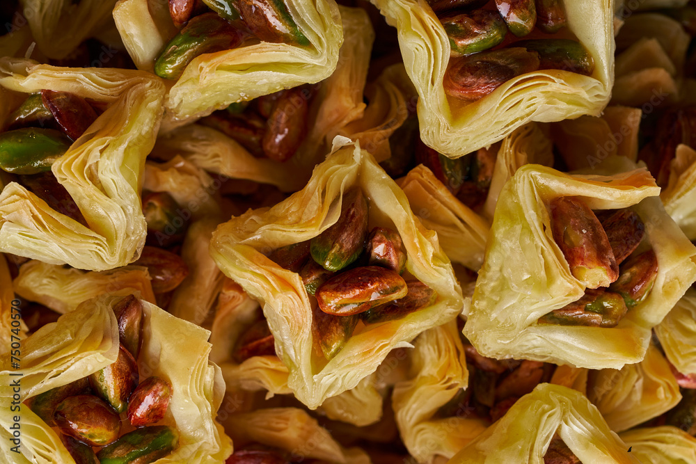 A close-up photo of Arabic and Turkish sweets and baklava with pistachios, Ramadan sweets