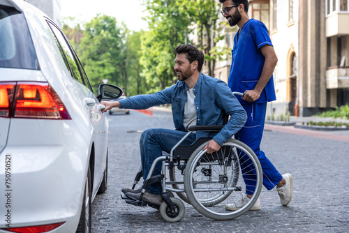 Man in a wheelchair opening a car door