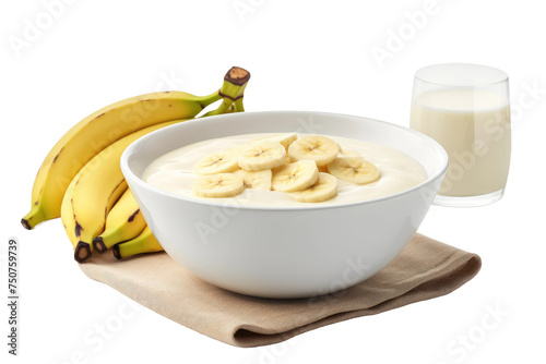 Bowl of Oatmeal With Bananas and Glass of Milk. A bowl filled with oatmeal topped with slices of bananas is placed next to a tall glass of milk on a table. Isolated on a Transparent Background PNG.