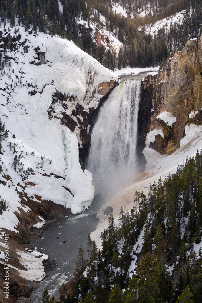 Snowy lower falls of the yellowstone national park at sunset