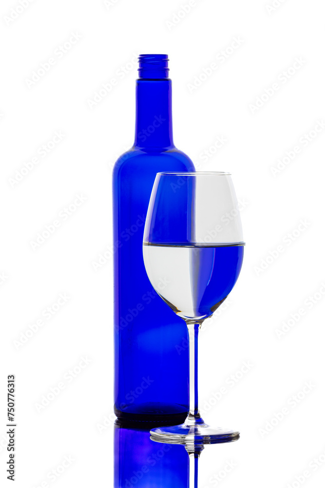 A colorful bottle with reflections in a wine glass
A colorful bottle with reflections in a wine glass