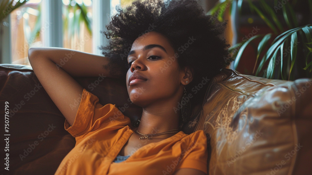 Young African American Woman Relaxing on Sofa at Home Young African American Woman Relaxing on Sofa at Home